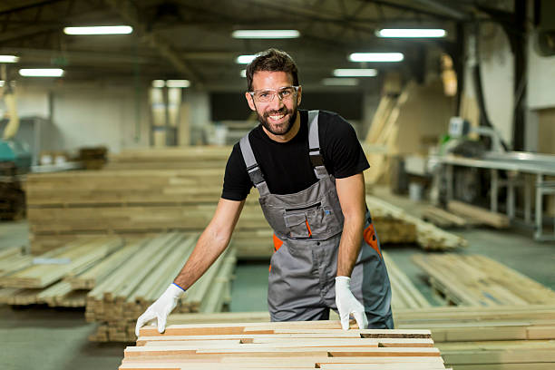 istock Young worker works in a factory for the production 637304482