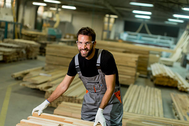 istock Young worker works in a factory for the production 637304486