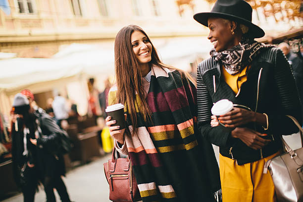istock Multiracial modern women walking in the town 637304810