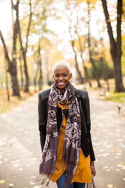istock Black woman in park 637305296