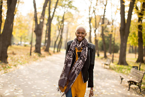 istock Black woman in park 637305328