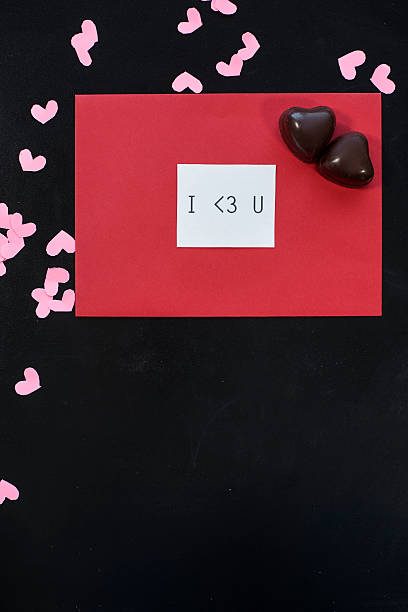 istock Chocolate heart and paper ones 637309620