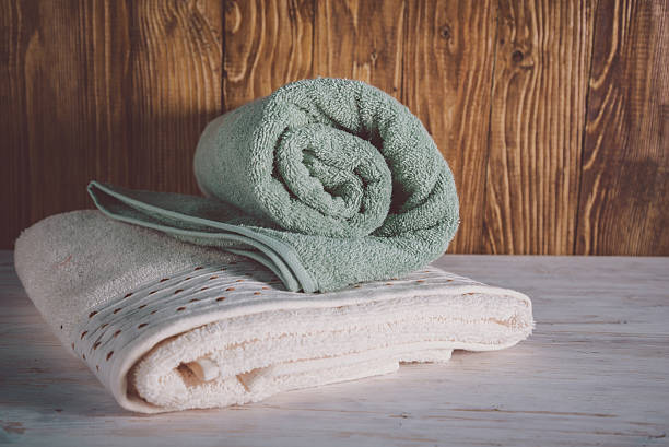 istock Stacked towels on wooden background 637310948