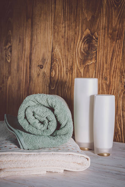 istock Stacked towels on wooden background 637311072