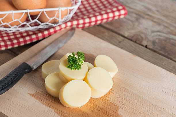 istock Sliced Egg Tofu on wood cutting board. 637311320