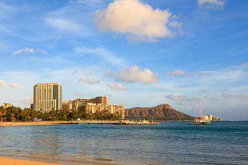 Honolulu - July 17, 2011 : View of people on Waikiki beach and Diamond head in the background