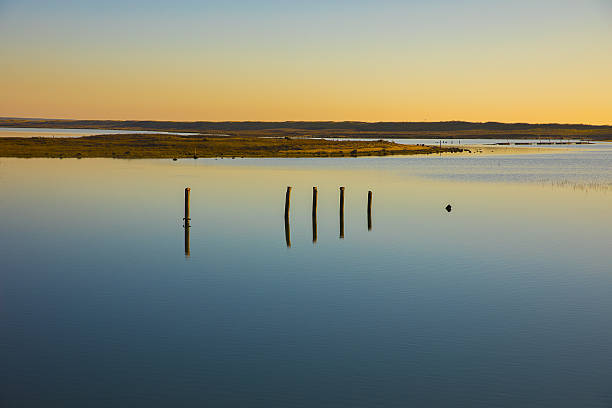 istock sunset on a lagoon with colorful reflection in still water 637311954