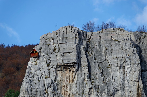 Red wooden climber house in the Lakatnik rocks, Iskar river defile, Sofia province, Bulgaria