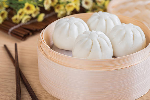 istock Steamed buns in bamboo steamer basket 637316556