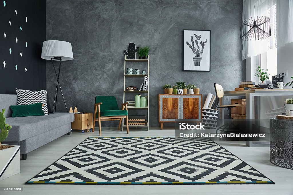 Grey room with pattern carpet Grey room with pattern carpet and wooden furniture Carpet - Decor Stock Photo