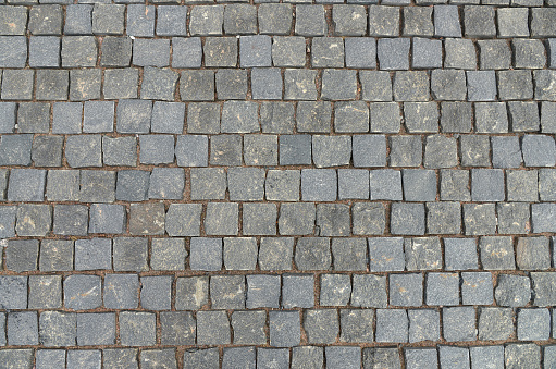 Abstract background of old cobblestone pavement view from above