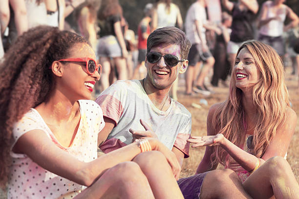 istock Friends with colored clothes and faces 637318650