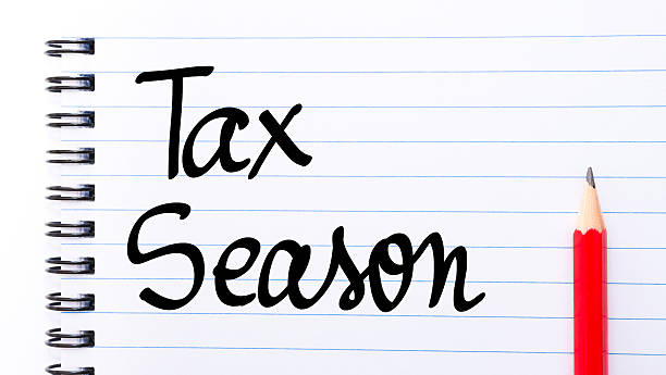 istock Tax Season written on notebook page 637321370