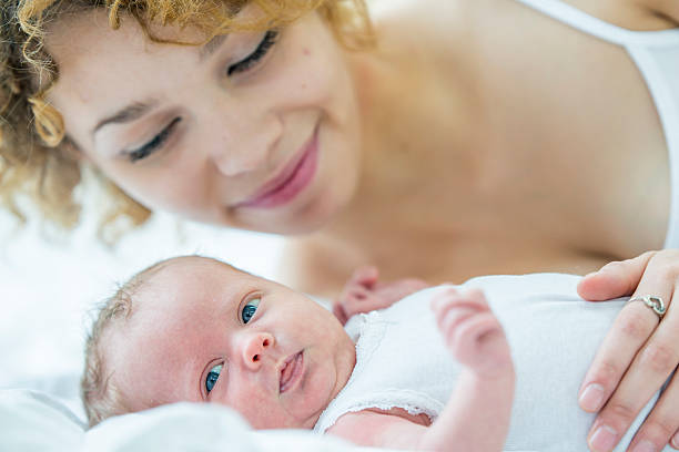 istock Mother Relaxing with Her Baby 637321398