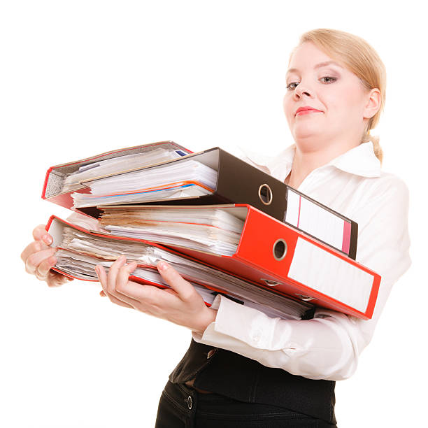 istock Business woman holding stack of folders documents 637322470