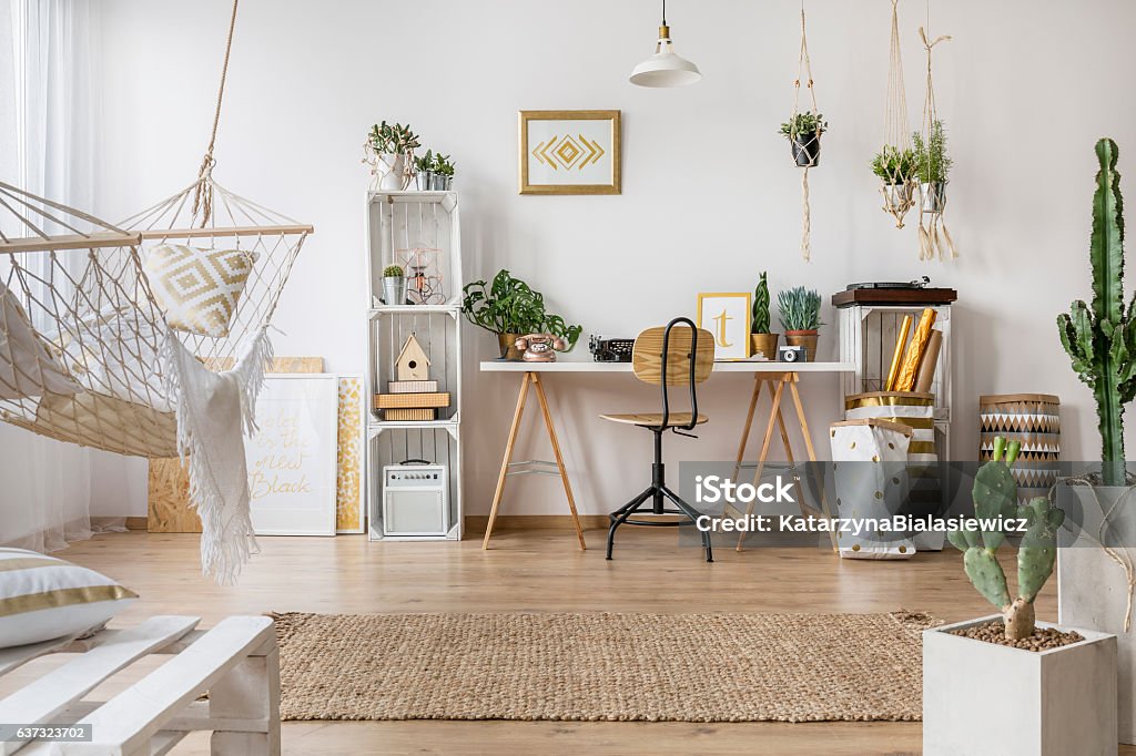 Multifunctional loft apartment Multifunctional loft apartment with stylish hammock Boho Stock Photo