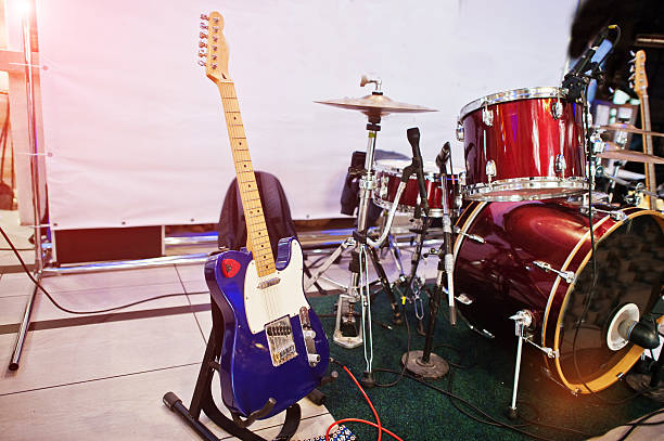 istock Set of musical instruments. Guitar and drums 637324302