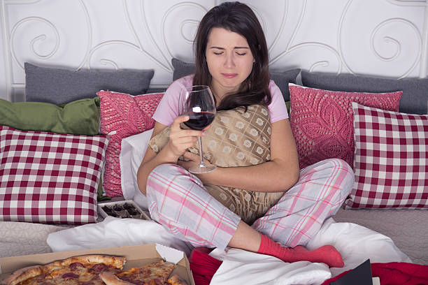 istock Depressed woman sitting on couch 637324818