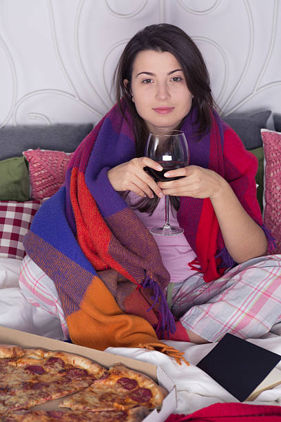 istock Woman spending evening in bed 637324884