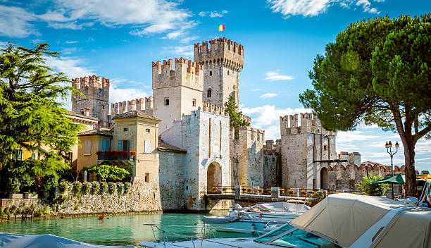 Rocca Scaligera castle in Sirmione town near Garda Lake Sirmione, Italy - July 16, 2014: Rocca Scaligera castle in Sirmione town near Garda Lake in Italy italian lake district photos stock pictures, royalty-free photos & images