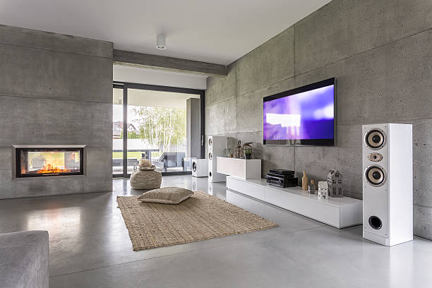 Tv living room with window Tv living room with window, fireplace and concrete wall effect entertainment center stock pictures, royalty-free photos & images