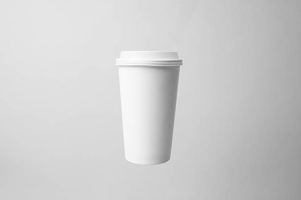 Blank white paper cup in the air