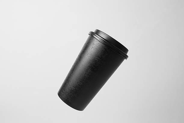 istock Blank black paper cup in the air 637327950