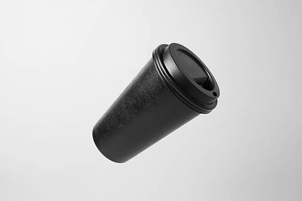 istock Blank black paper cup in the air 637328566