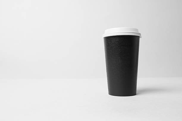istock Black paper cup with white cap mockup 637328872
