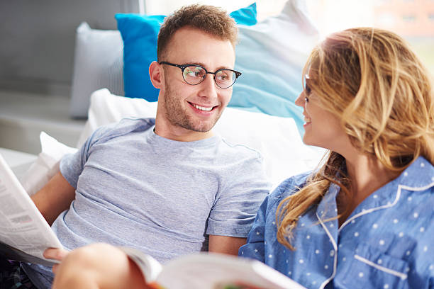 istock Morning reading newspapers in bed 637329008