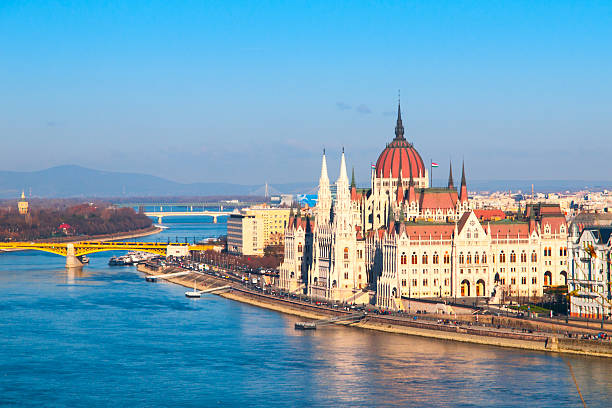 Hungarian Parliament historical building on Danube riverbank in Budapest, Hungary Hungarian Parliament, aka Orszaghaz, historical building on Danube riverbank in the centre of Budapest, Hungary, Europe. UNESCO World Heritage Site. Aerial view from Buda Castle. danube river stock pictures, royalty-free photos & images