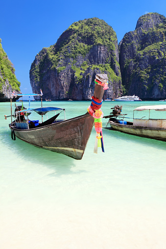 Long tail wooden boats stranded at Maya Bay, Phi Phi Islands, Thailand
