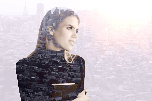istock Woman with book on city background 637335736