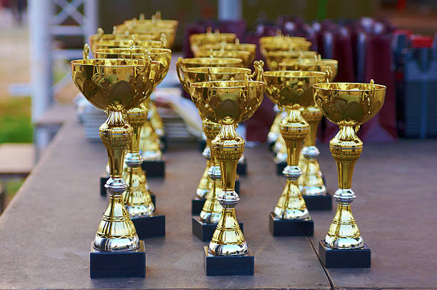 istock many golden cups at the presentation event 637337678