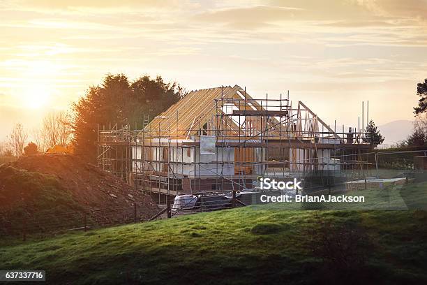 Building Site With House Under Construction Stock Photo - Download Image Now - House, Construction Industry, Construction Site