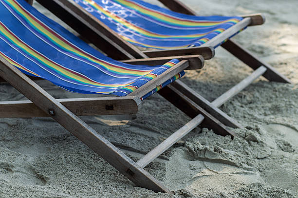 istock Old vintage wooden sun beds at the beach 637339980