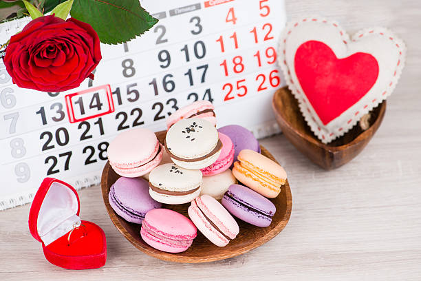 istock Concept Valentine's Day, gold ring, heart and pastries on backgr 637340406