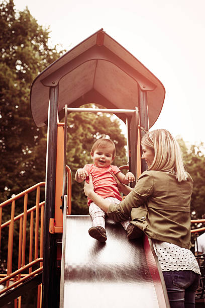 istock Mother in the park with her baby. 637341054