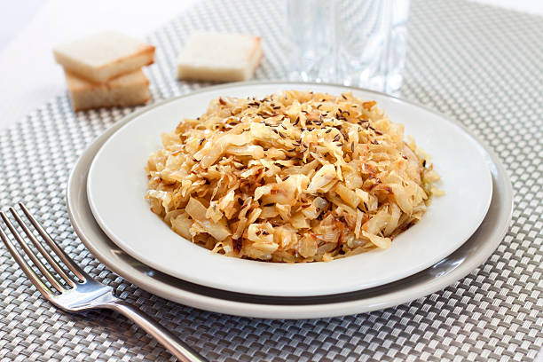 istock Fried cabbage with caraway and garlic on a plate 637341398