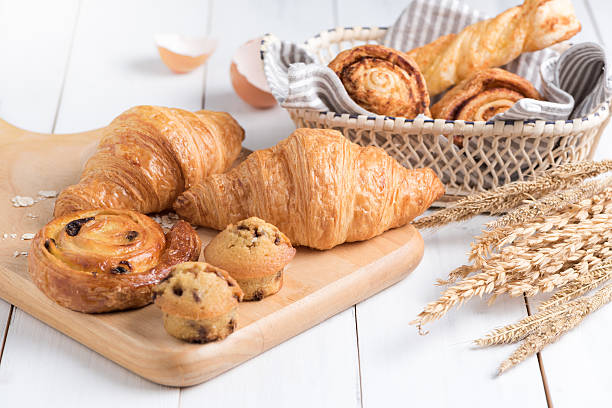 Homemade croissant  on white wood background Homemade croissant  and bakery on white wood background, breakfast food bakery stock pictures, royalty-free photos & images