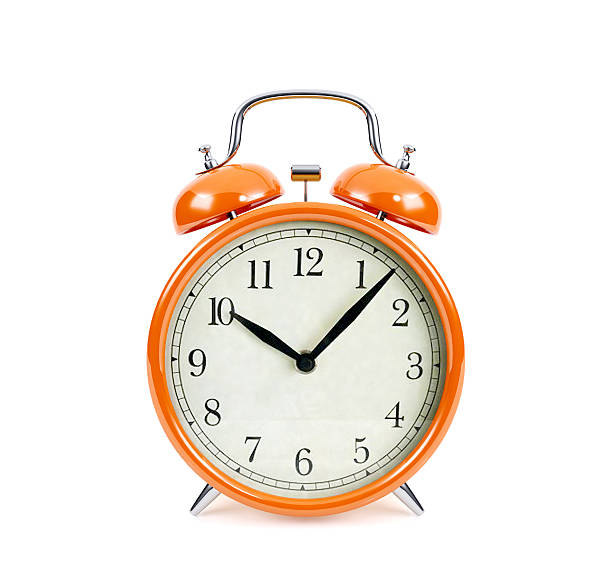 istock Orange alarm clock isolated on white background 637341738