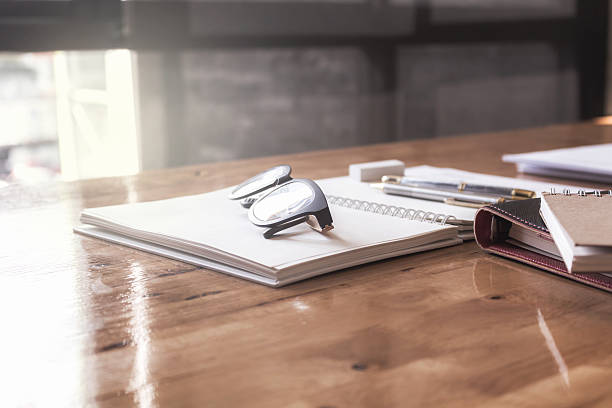 istock Glasses on the table with the engineer's office. 637342800