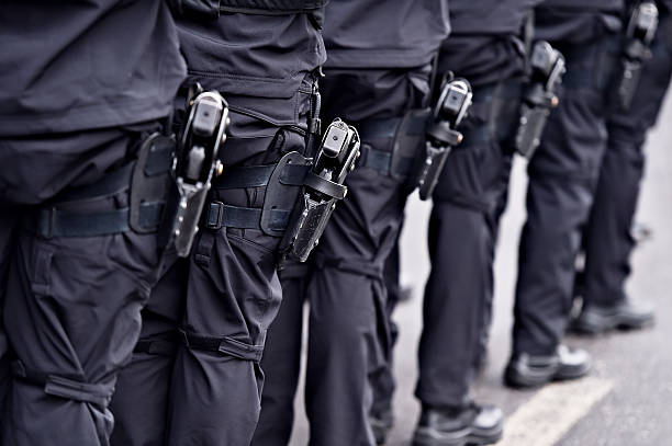 istock Special forces soldiers with pistols in scabbards 637343252