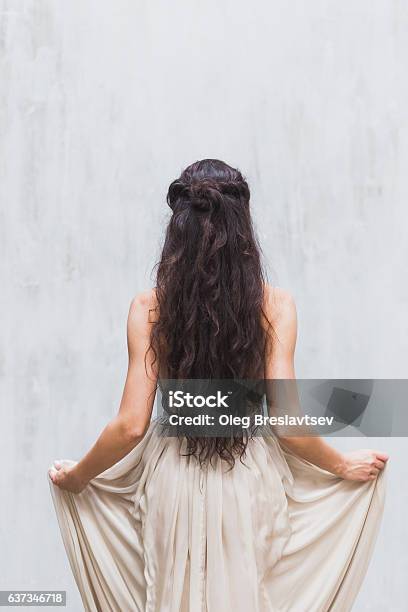 Girl With Long Black Hair In Gentle Silk Wedding Dress Stock Photo - Download Image Now
