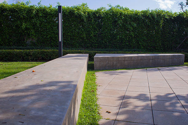 istock stone bench in green garden 637347024