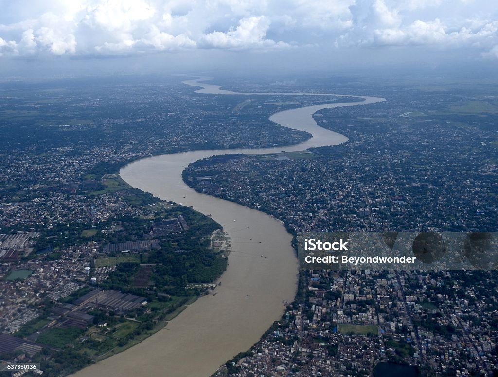 River Ganga at Kolkata The holiest river of India, the river Ganga passes through the city of Kolkata before emptying into Bay of Bengal around 120km away. Ganges River Stock Photo
