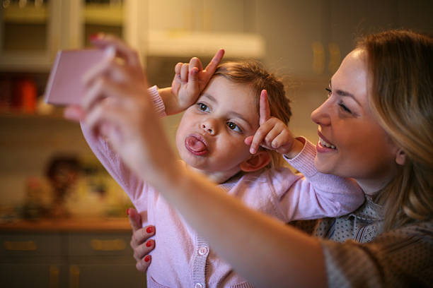 istock Mother with daughter making funny face. 637350404