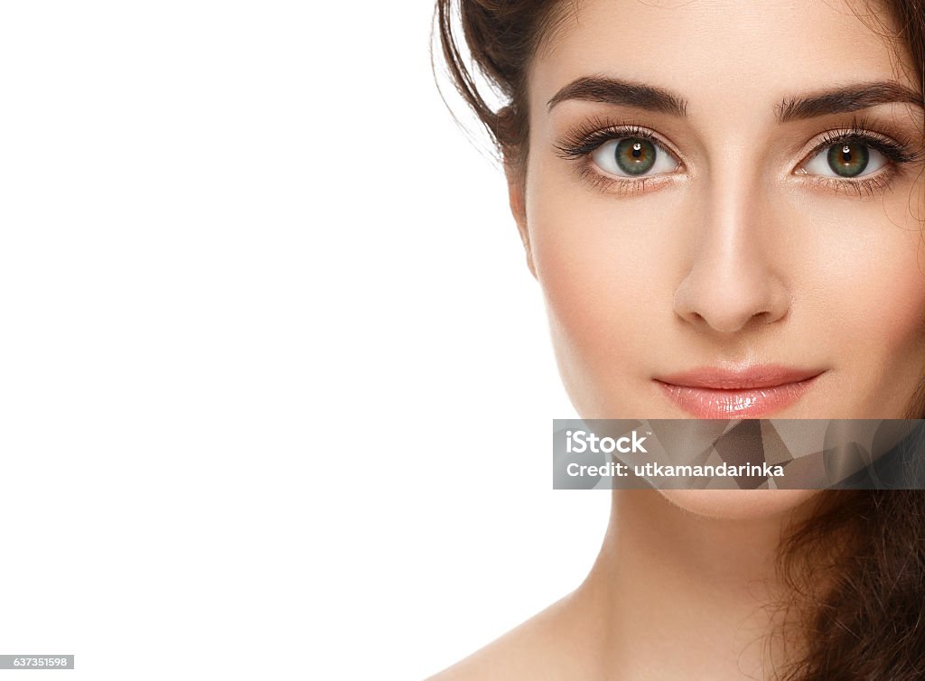 Beautiful Face of Young Woman with Perfect Skin. Isolated white. Beautiful Face of Young Woman Model with Clean Fresh Perfect Healthy Skin. Age and Health Concept. Beauty Woman Portrait isolated on white Eye Stock Photo
