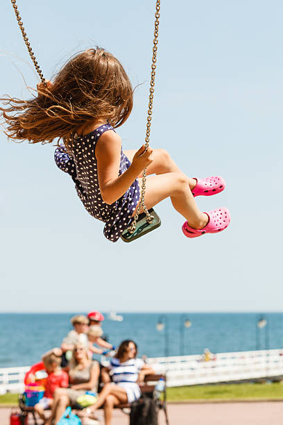istock Playful crazy girl on swing. 637354656