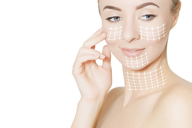 istock beautiful woman face with surgery marks 637355464
